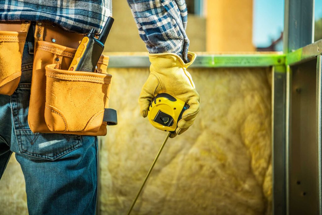 Man holding a measuring tape