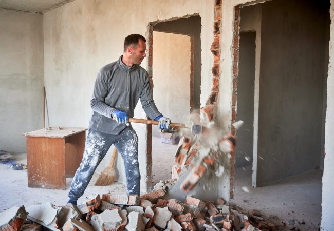 Man working on internal demolition