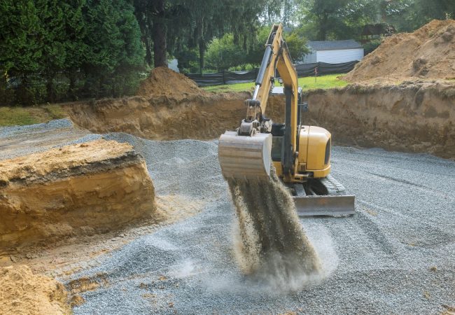 Industrial excavator for foundation building construction site, bucket details, dirt gravel